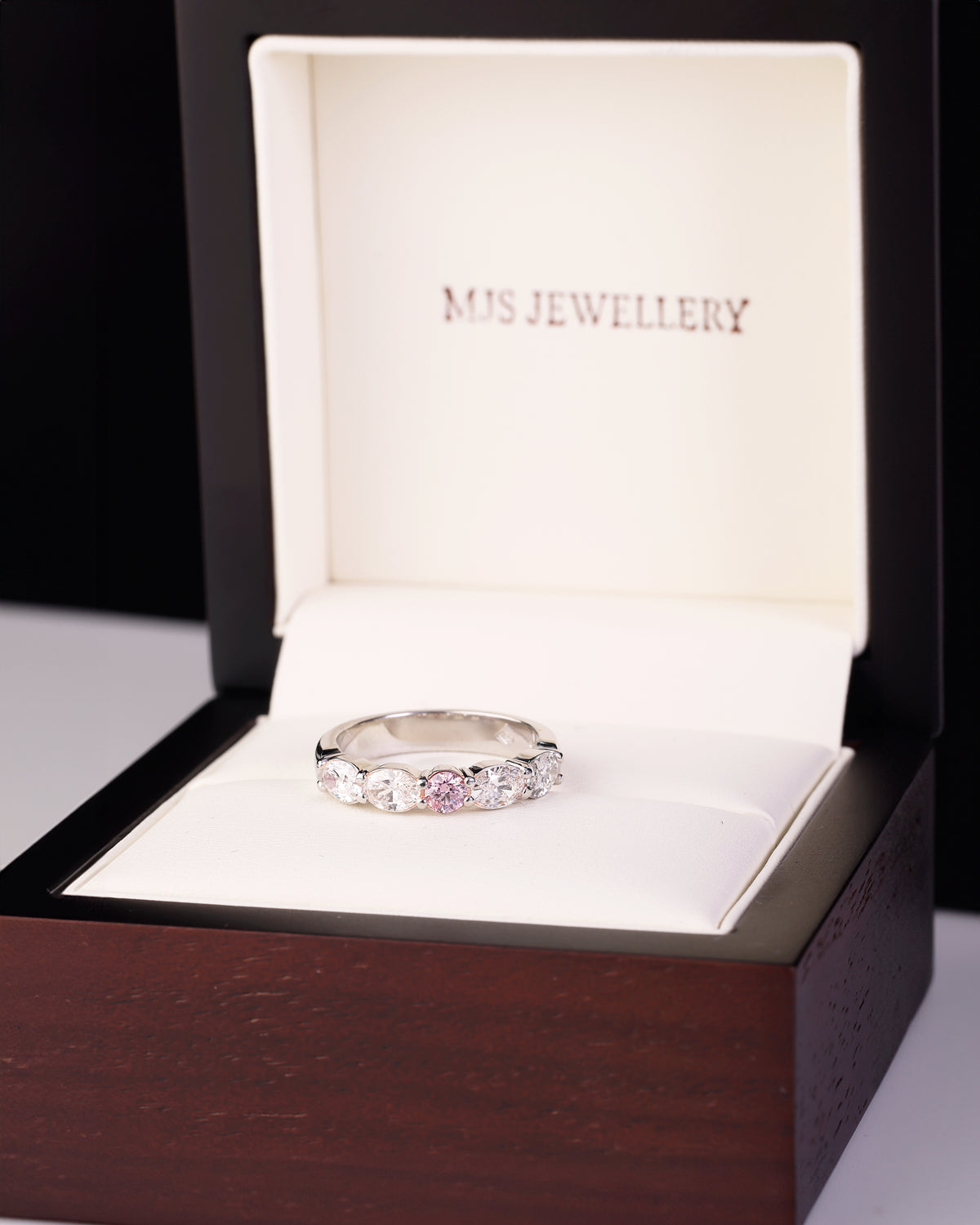 Argyle mine Pink Diamond and Oval Cut Diamond Band in Platinum