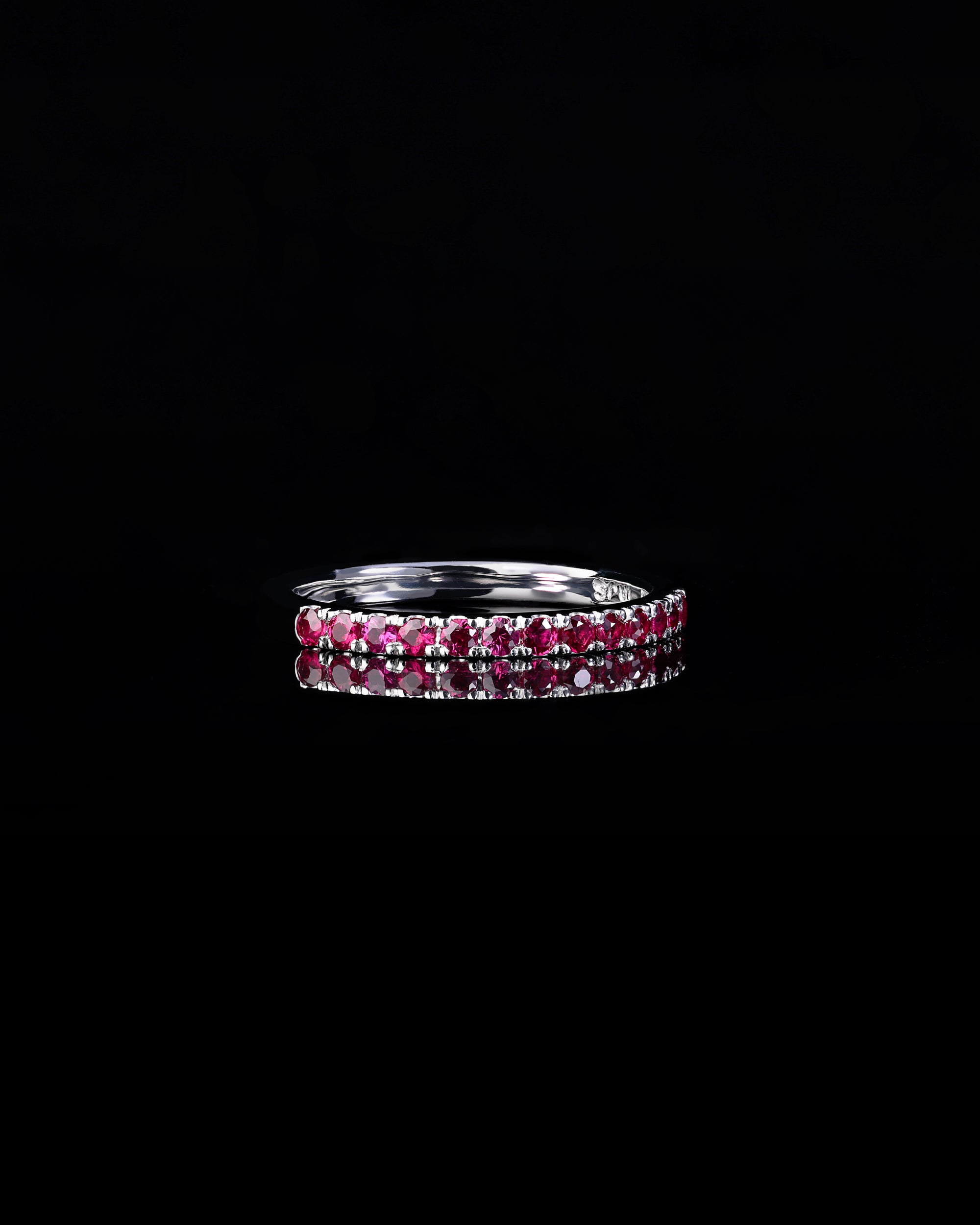 Handcrafted 18ct White Gold band half set with Rubies.