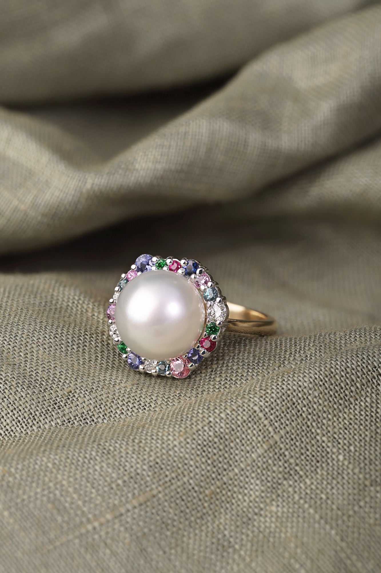 Australian South Sea Pearl surrounded by a medley of Precious Gemstones dress ring.